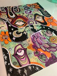 a piece of art with colorful designs on it